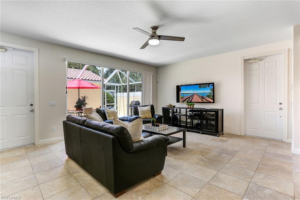 8334 Rimini Way Naples, FL 34114 - Photo 5 of 34 a living room with furniture a ceiling fan and a window