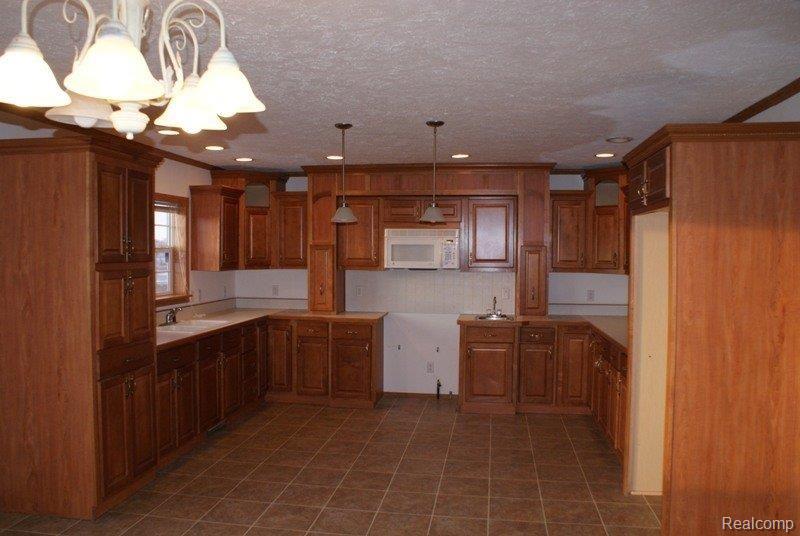 3366 Howard Road Marlette, MI 48453 - Photo 5 of 13 So Many Cabinets!