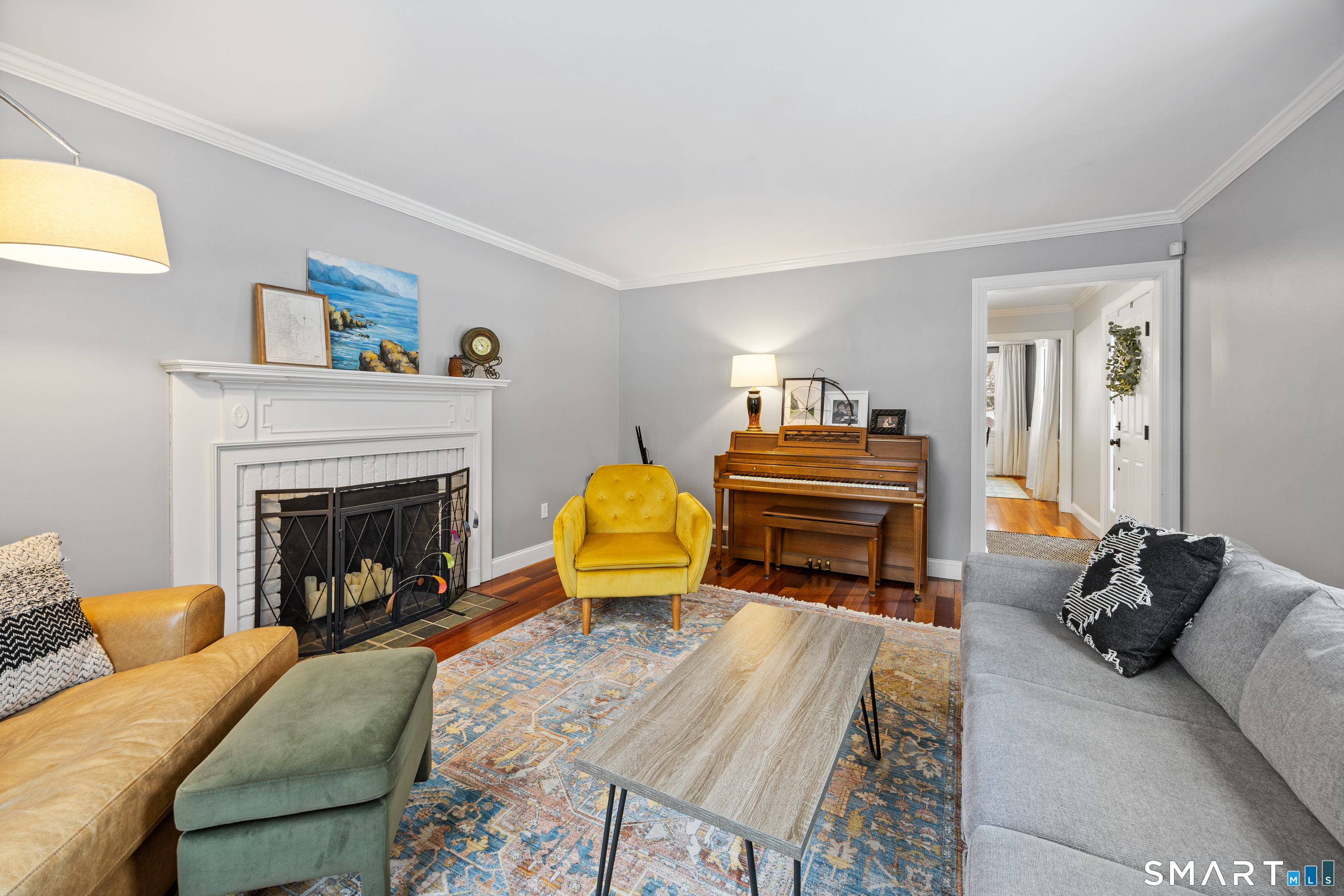 5 Crosswood Road Farmington, CT 06032 - Photo 18 of 40 a living room with furniture and a fireplace