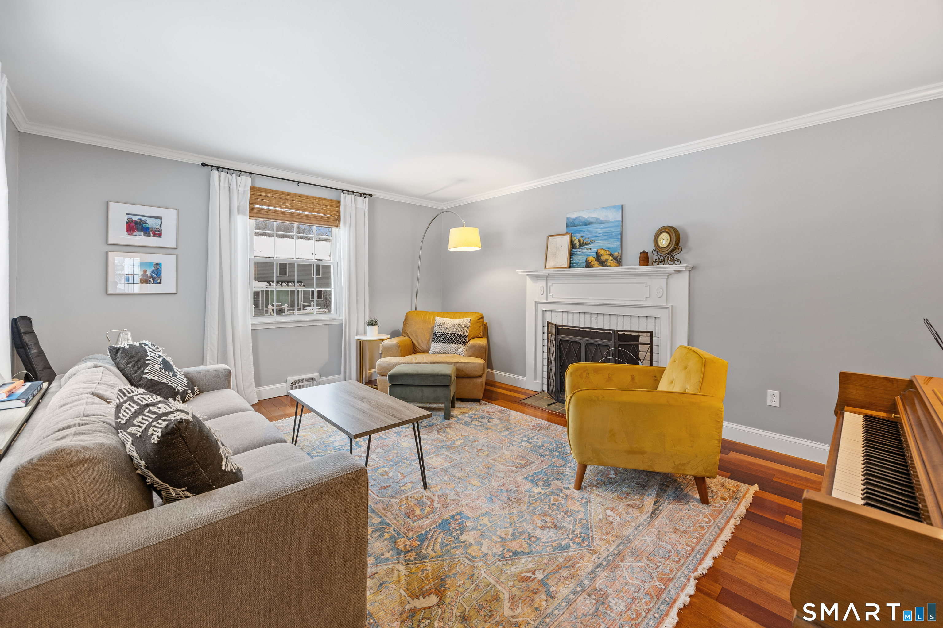 5 Crosswood Road Farmington, CT 06032 - Photo 19 of 40 a living room with furniture wooden floor and a fireplace