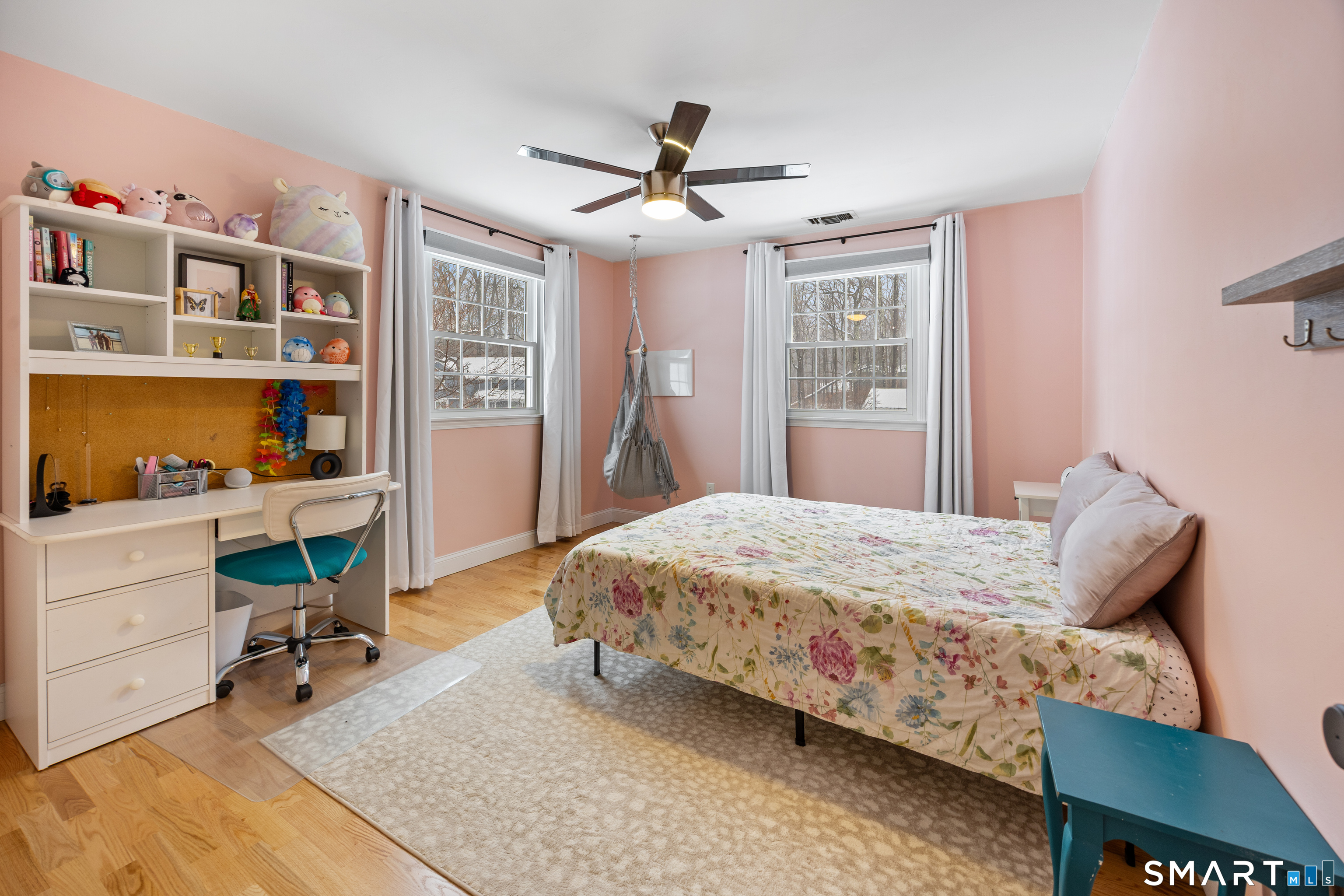 5 Crosswood Road Farmington, CT 06032 - Photo 24 of 40 a bedroom with a bed a desk and book shelfs