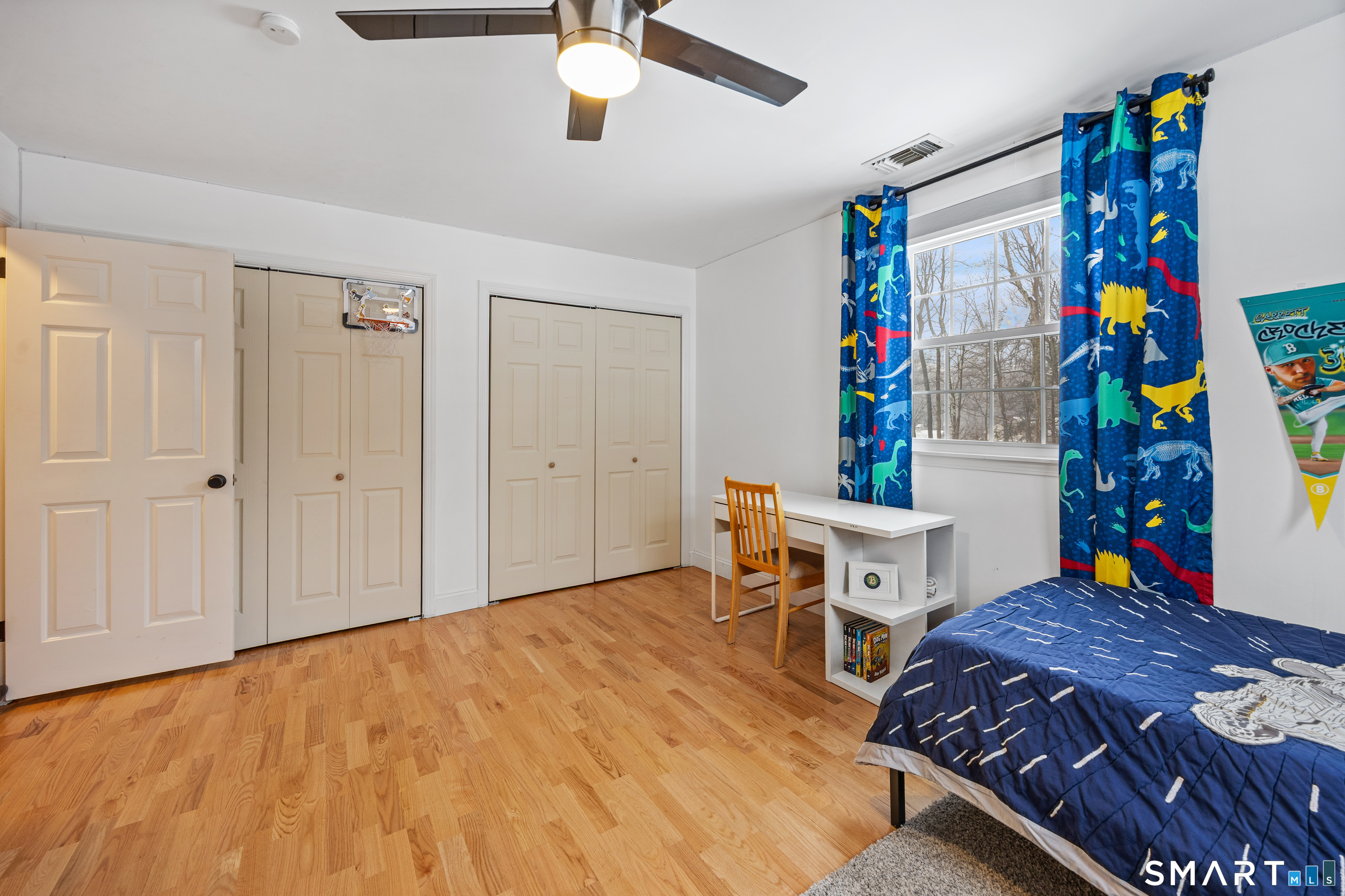 5 Crosswood Road Farmington, CT 06032 - Photo 27 of 40 a bedroom with a bed and a table in it