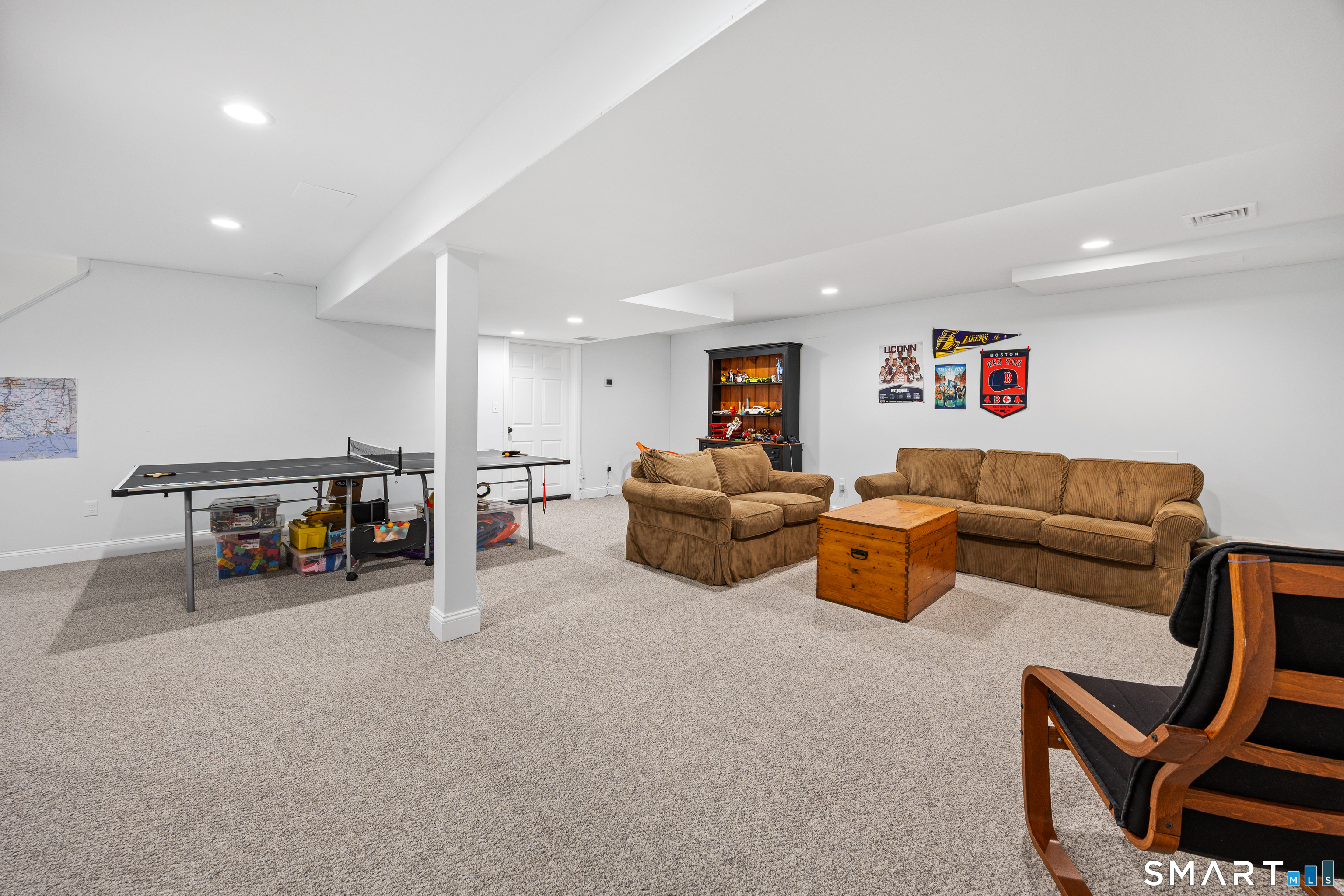 5 Crosswood Road Farmington, CT 06032 - Photo 29 of 40 a living room with furniture and a flat screen tv