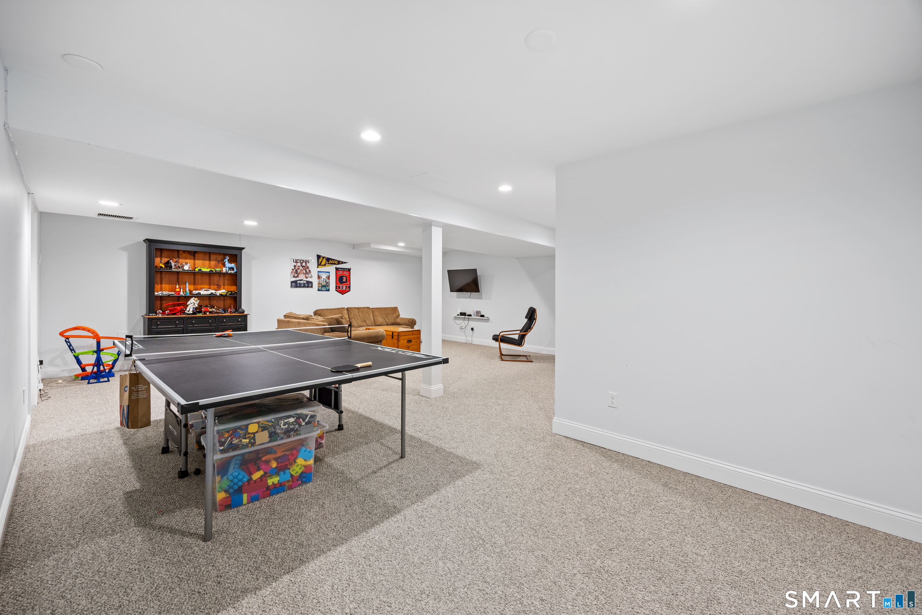 5 Crosswood Road Farmington, CT 06032 - Photo 30 of 40 a room with furniture and a flat screen tv