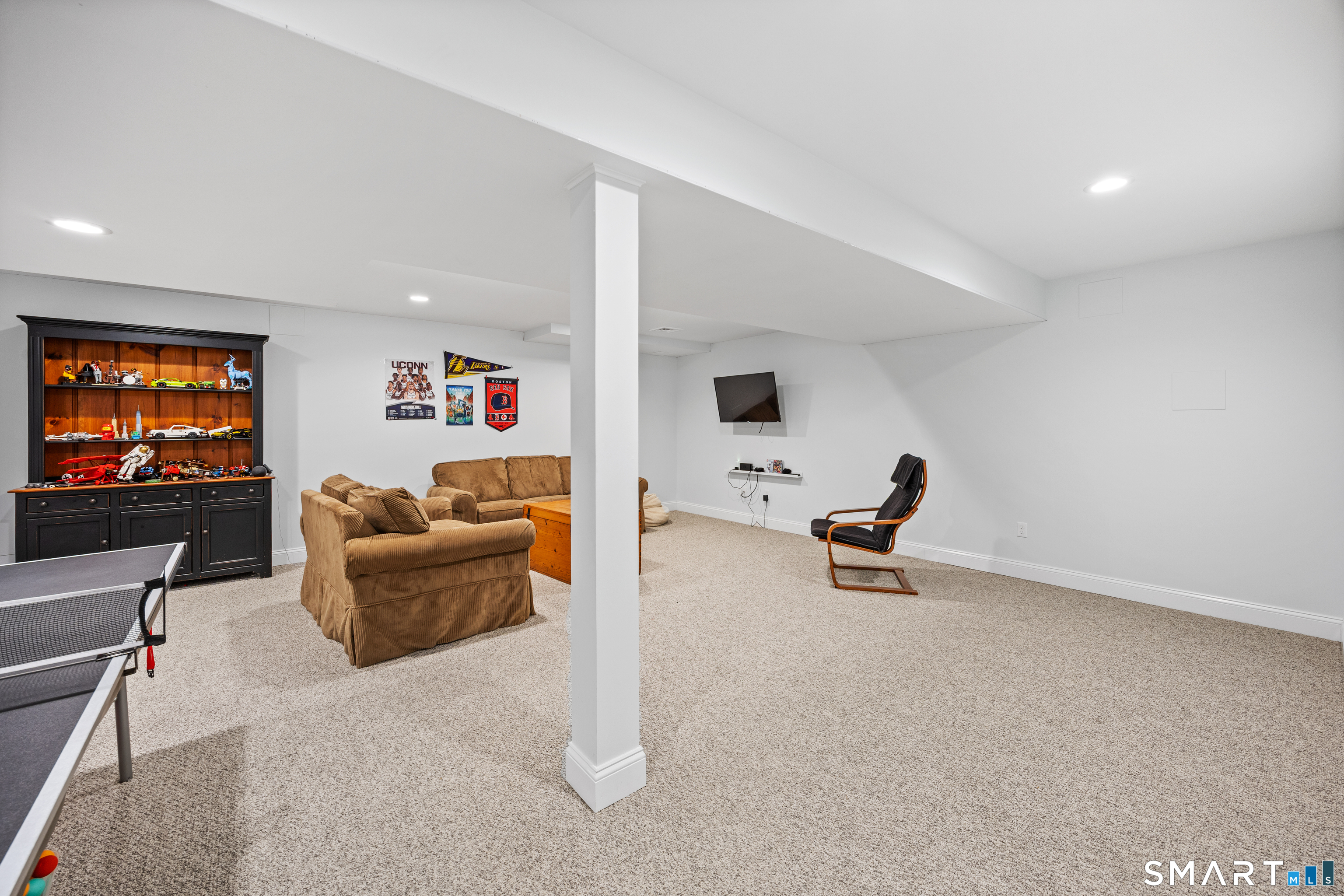 5 Crosswood Road Farmington, CT 06032 - Photo 31 of 40 a living room with furniture and a flat screen tv