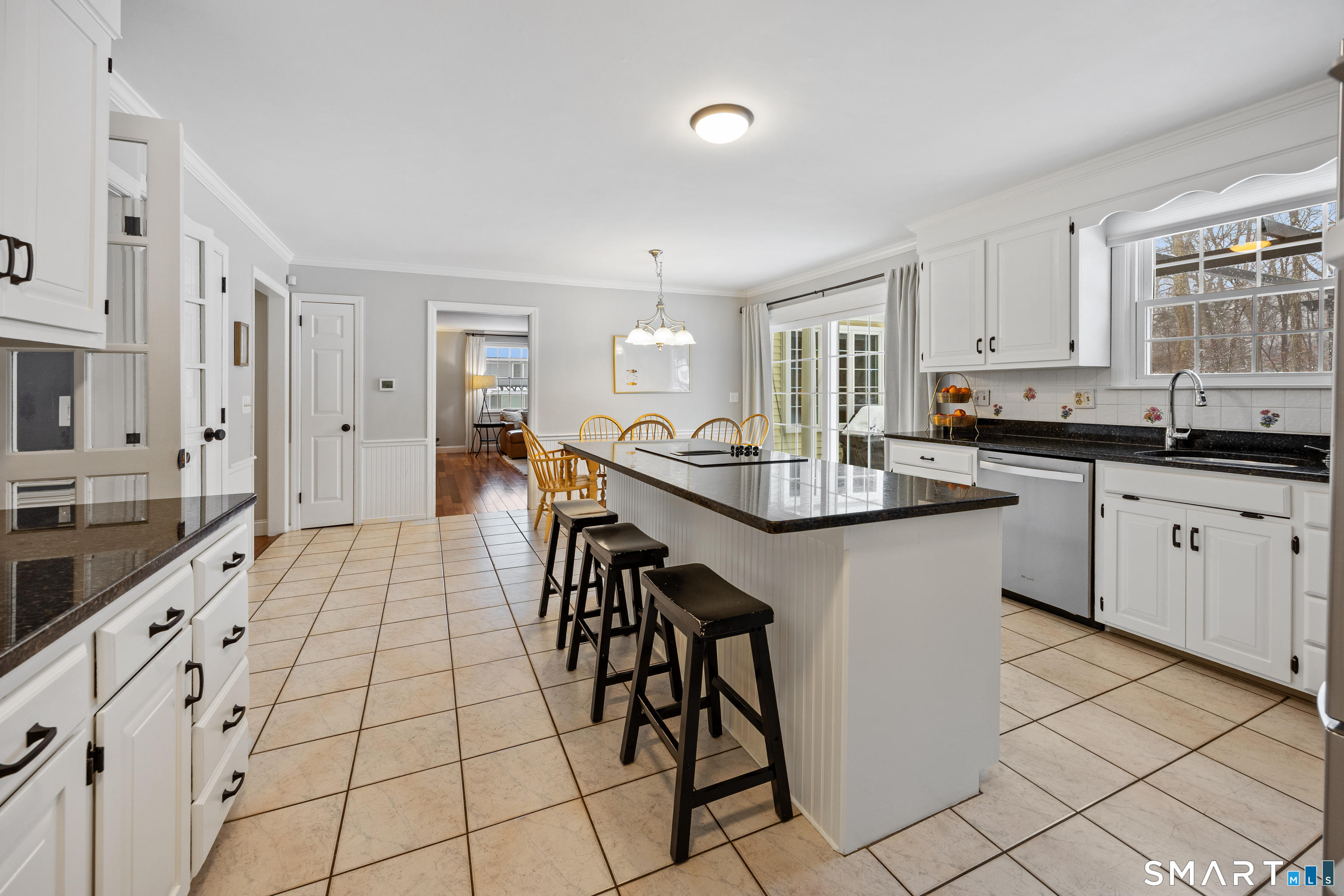 5 Crosswood Road Farmington, CT 06032 - Photo 7 of 40 a kitchen with stainless steel appliances kitchen island granite countertop a sink and cabinets