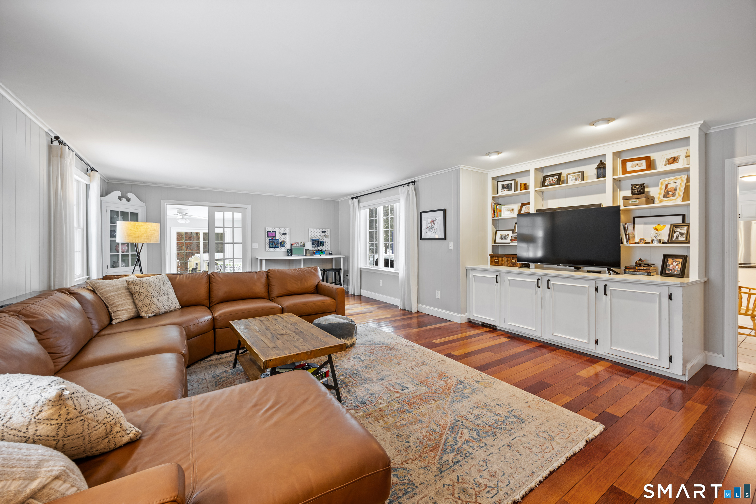 5 Crosswood Road Farmington, CT 06032 - Photo 10 of 40 a living room with furniture and a flat screen tv