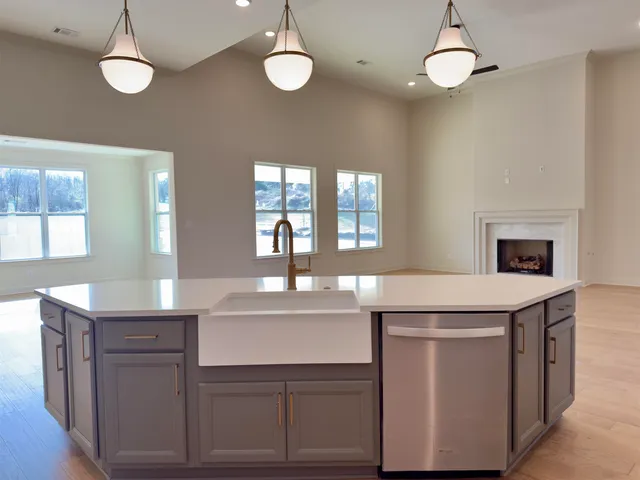 a kitchen with cabinets appliances and a counter space