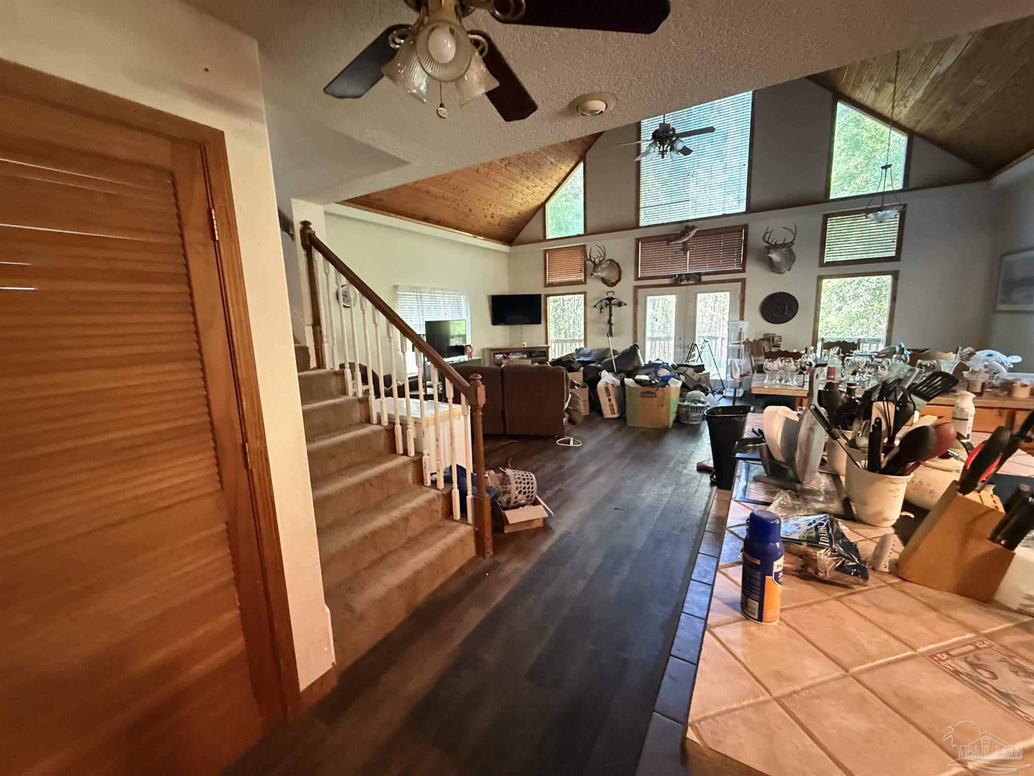 9543 Quiet Creek Road Milton, FL 32570 - Photo 18 of 45 a view of a livingroom with furniture and hardwood floor