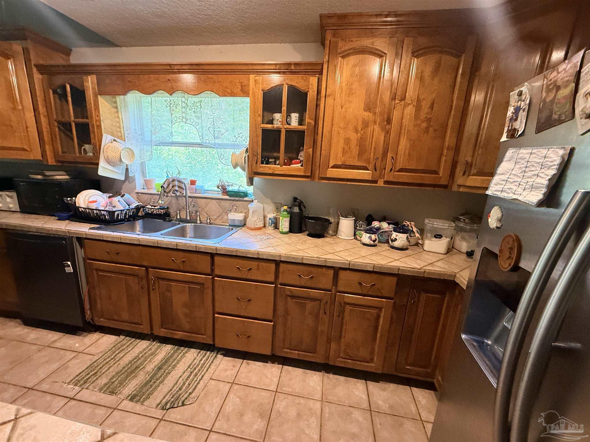 9543 Quiet Creek Road Milton, FL 32570 - Photo 21 of 45 a kitchen with a sink and cabinets