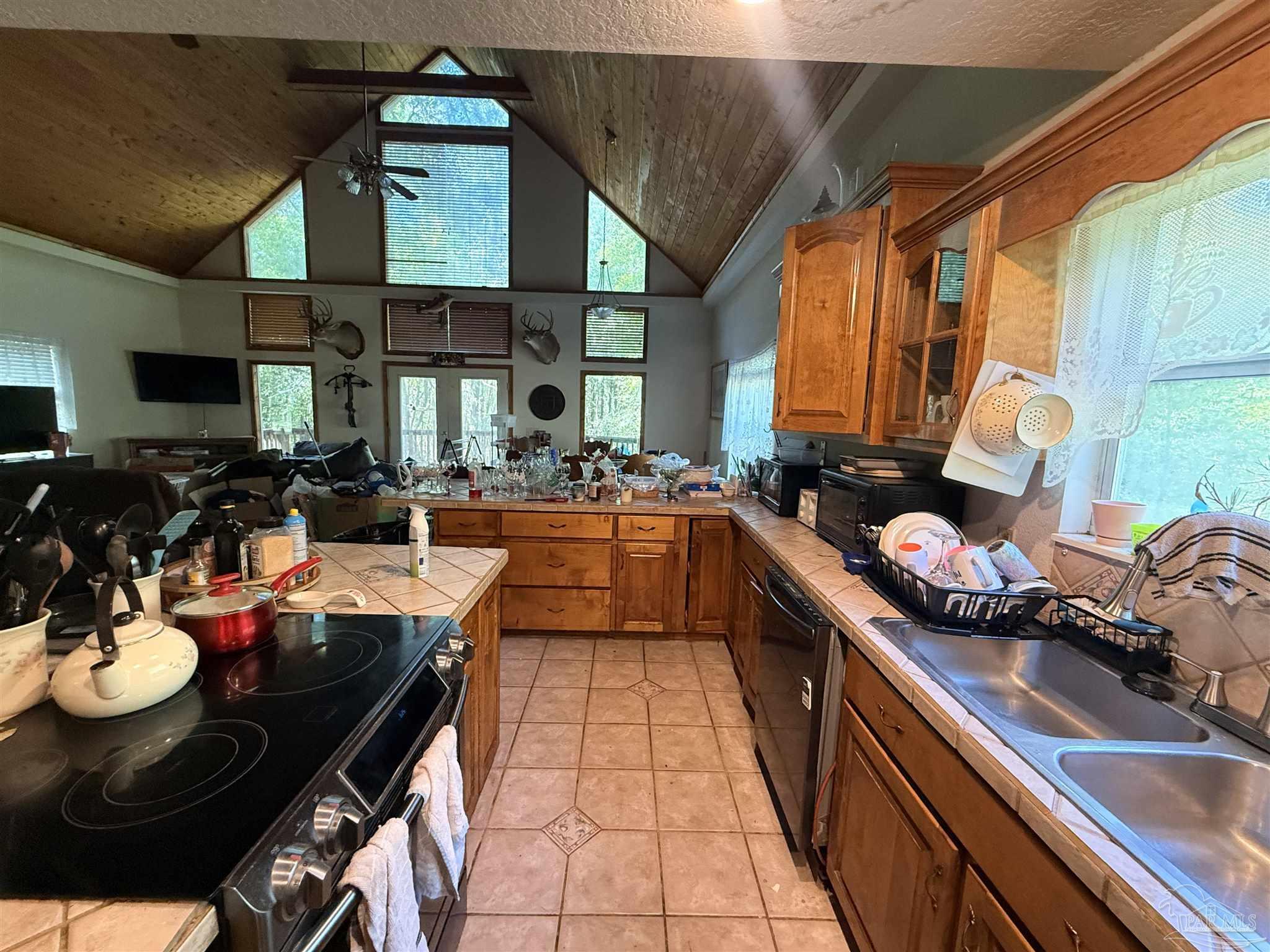 9543 Quiet Creek Road Milton, FL 32570 - Photo 23 of 45 a kitchen with stainless steel appliances granite countertop a sink a stove and a refrigerator