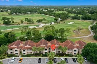 an aerial view of residential houses and outdoor space