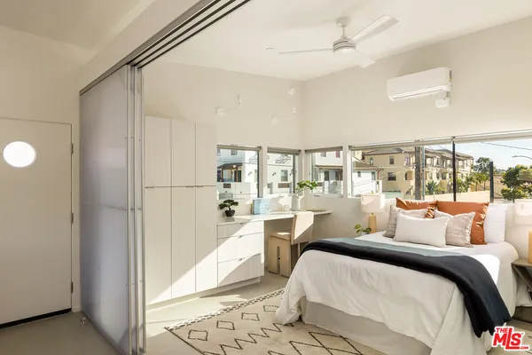 a view of a kitchen from a hallway