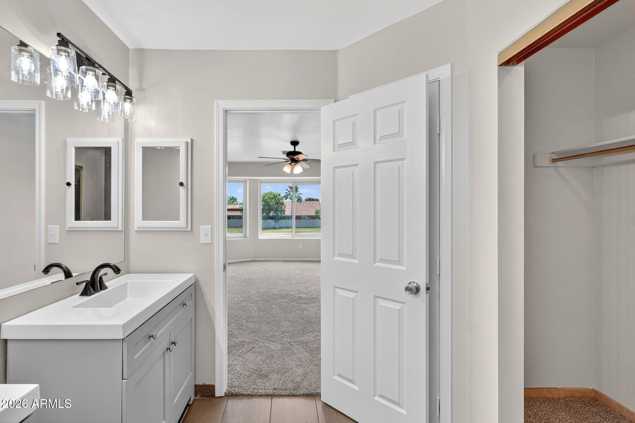 1417 East Mineral Road Gilbert, AZ 85234 - Photo 35 of 59 a spacious bathroom with a sink and a mirror