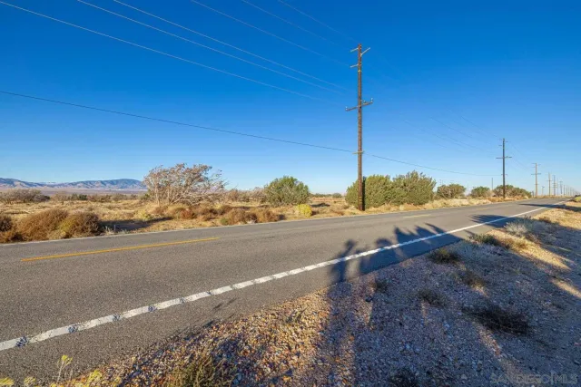 a view of a road with an ocean view