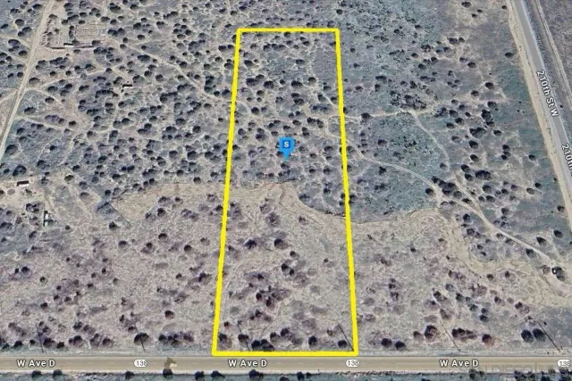 a view of a swimming pool with a yard