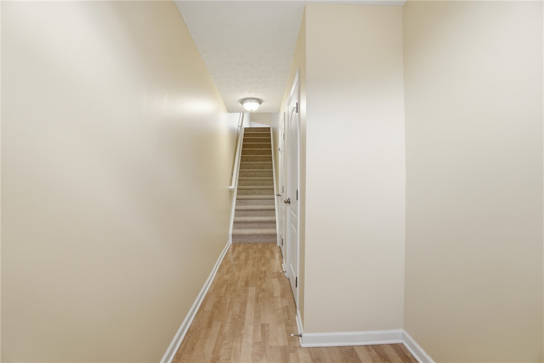 4324 Straight Arrow Road Dayton, OH 45430 - Photo 18 of 40 This inviting hallway offers a warm welcome, leading the way to upper levels of comfortable living.