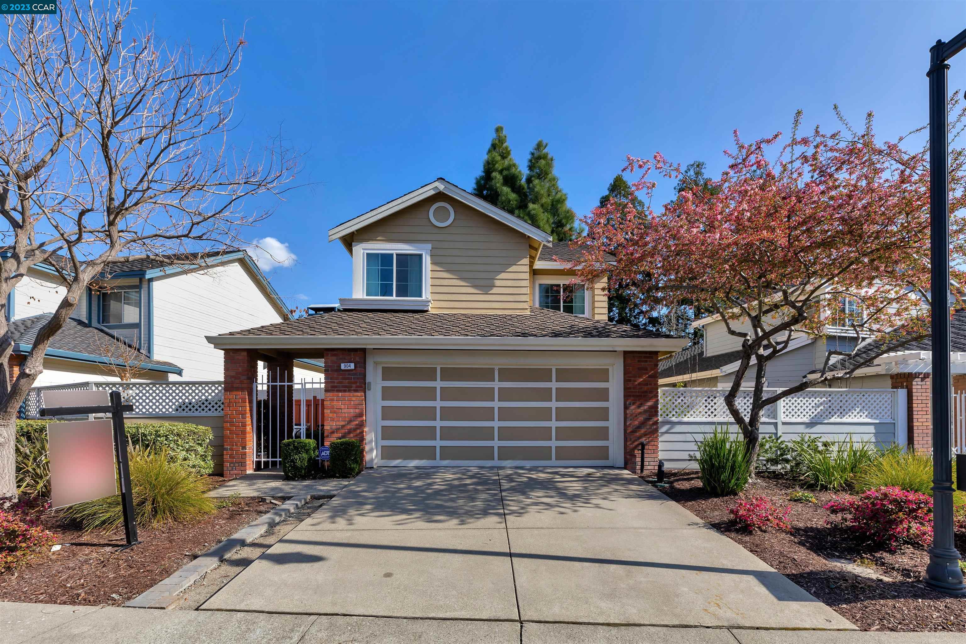 904 Springview Circle San Ramon, CA 94583 - Photo 1 of 1 a front view of a house with a yard and garage