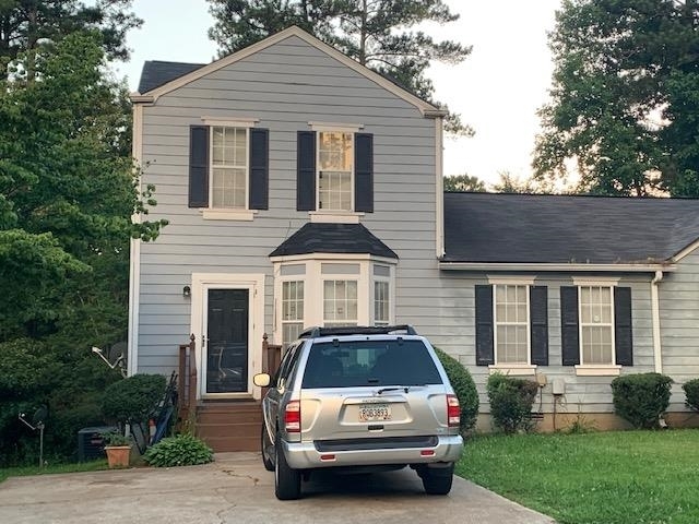3489 Kingswood Run Decatur, GA 30034 - Photo 1 of 1 a car parked in front of white house