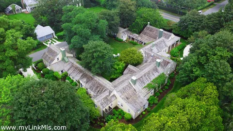 an aerial view of a house with outdoor space and street view