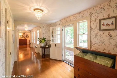 a view of a living room and a chandelier