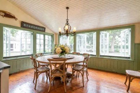 a dining room with furniture window wooden floor