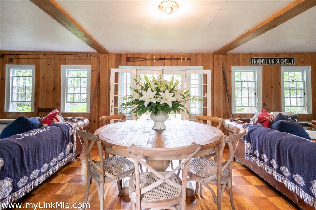 20 Main Street Nantucket, MA 02554 - Photo 22 of 33 a living room with furniture and a chandelier