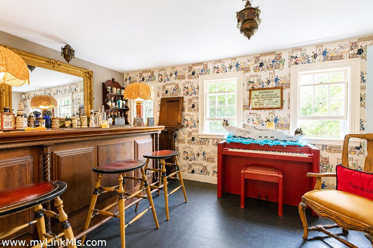20 Main Street Nantucket, MA 02554 - Photo 23 of 33 a dining room with a table and chairs in it