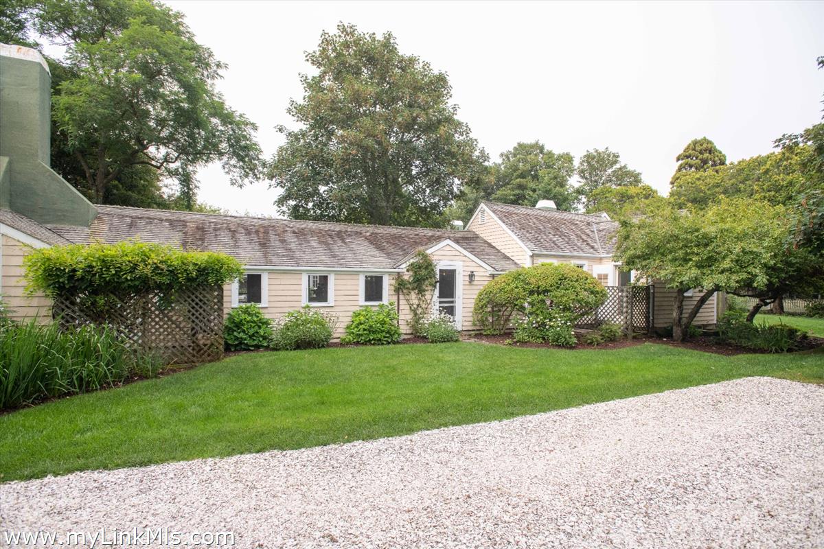 20 Main Street Nantucket, MA 02554 - Photo 27 of 33 a view of a house next to a big yard and large trees