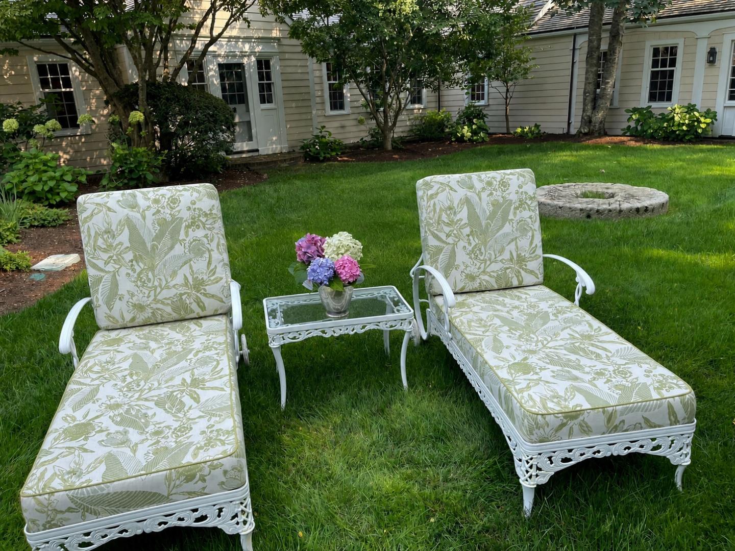 20 Main Street Nantucket, MA 02554 - Photo 31 of 33 a wooden bench sitting in the grass near a house