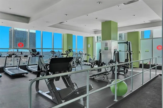 a room with lots of chairs and mirrors