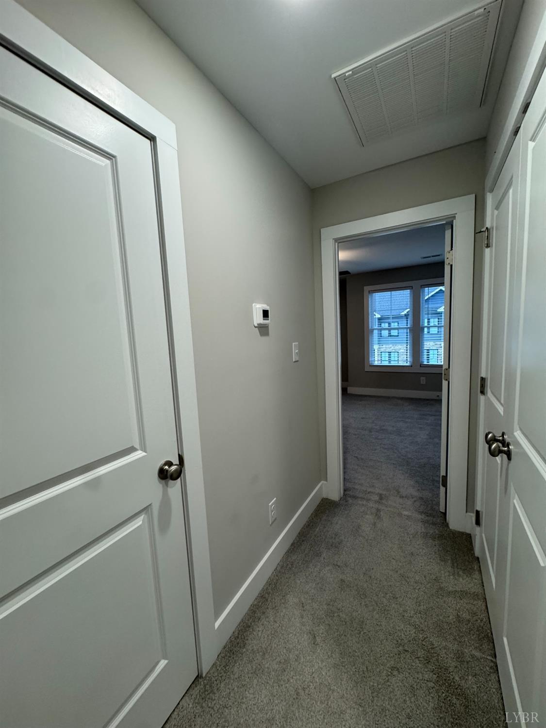 76 High Street Lynchburg, VA 24501 - Photo 12 of 22 a view of livingroom with hallway and window