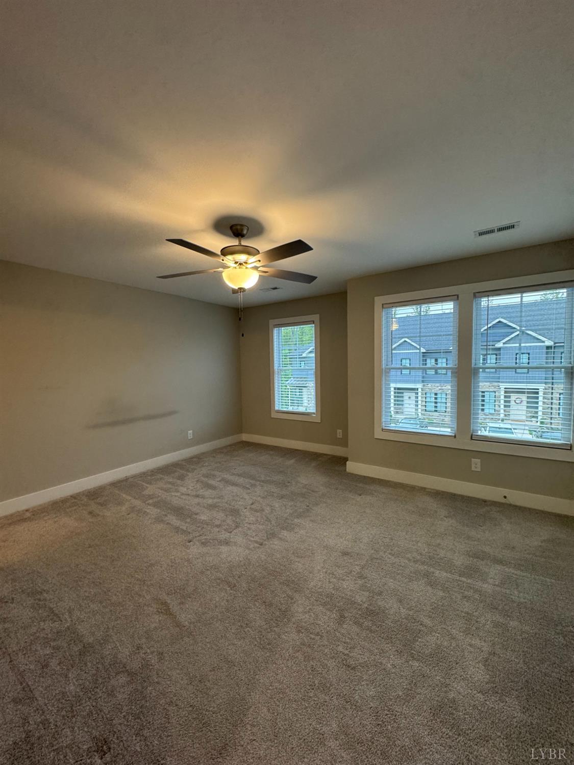 76 High Street Lynchburg, VA 24501 - Photo 13 of 22 an empty room with a empty space and windows