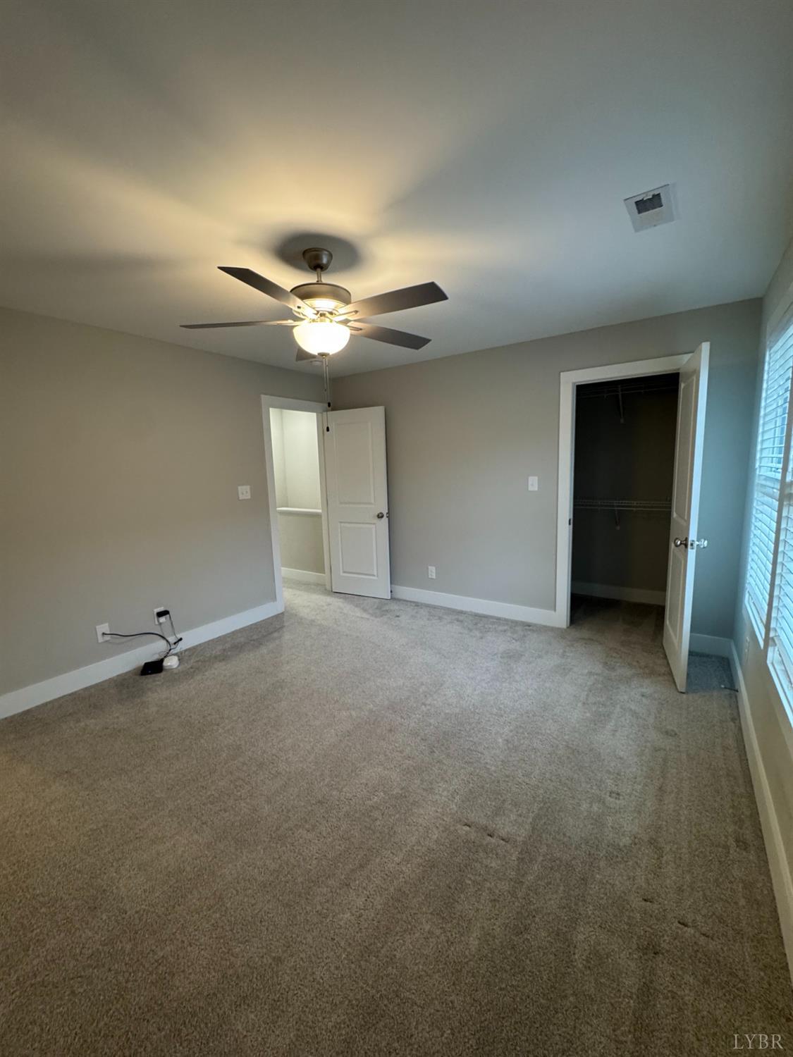 76 High Street Lynchburg, VA 24501 - Photo 18 of 22 a view of an empty room with a ceiling fan