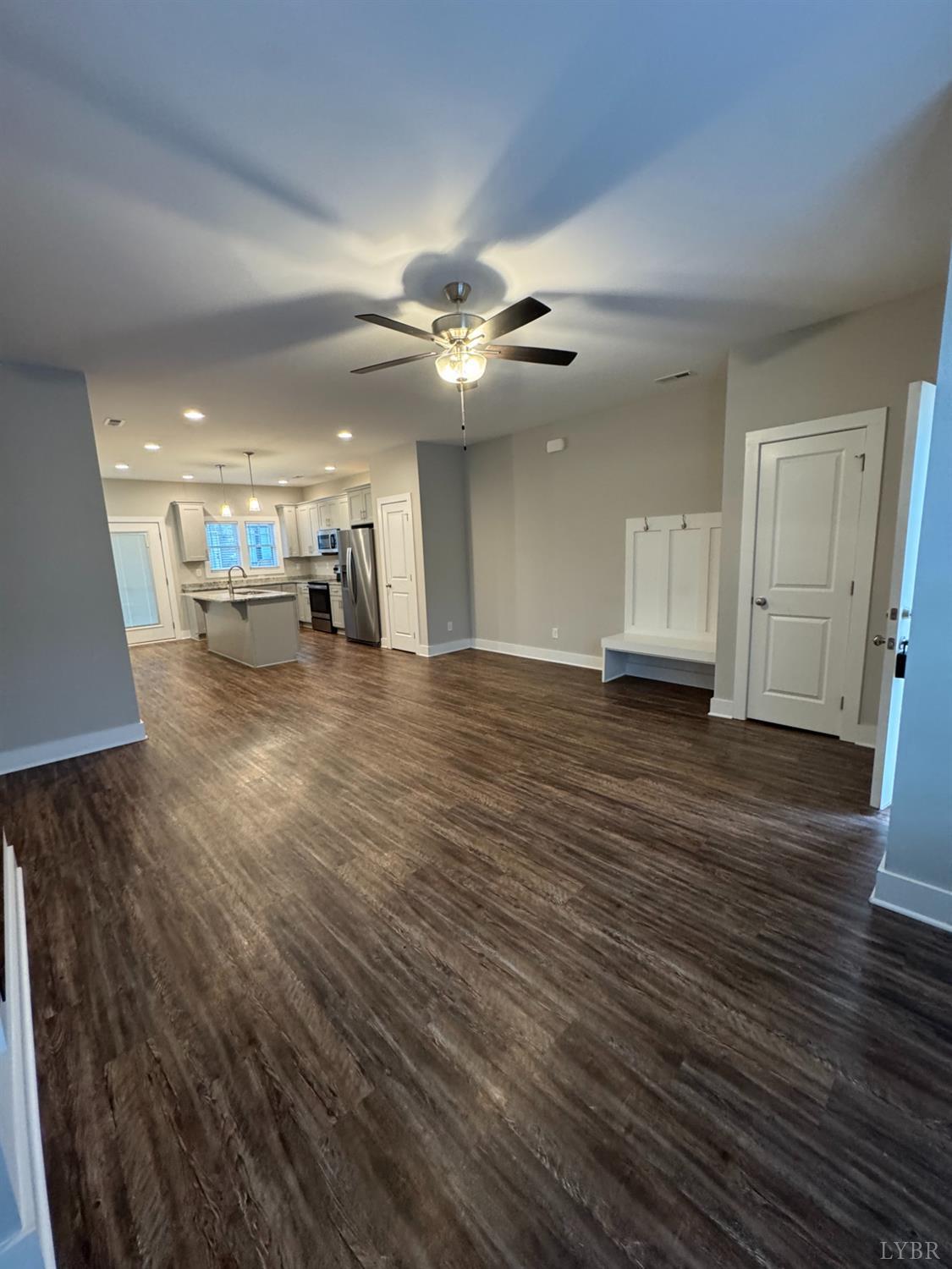 76 High Street Lynchburg, VA 24501 - Photo 2 of 22 a view of a room with wooden floor and a ceiling fan