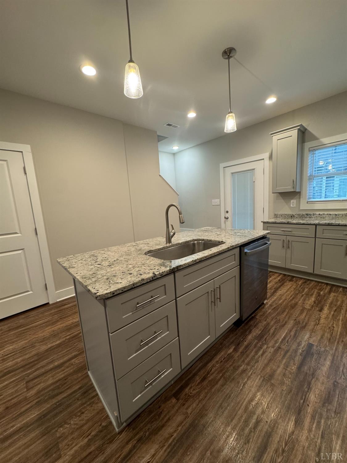 76 High Street Lynchburg, VA 24501 - Photo 8 of 22 a kitchen with sink cabinets and wooden floor