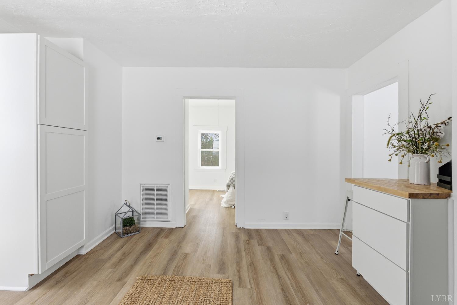 1015 7th Street Altavista, VA 24517 - Photo 16 of 31 a view of a room with wooden floor and a potted plant