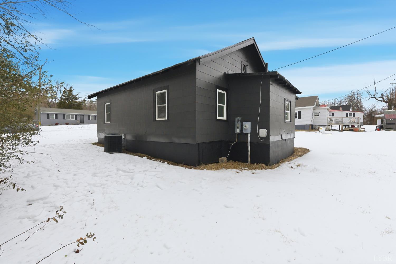 1015 7th Street Altavista, VA 24517 - Photo 29 of 31 a front view of a house with a yard covered in snow