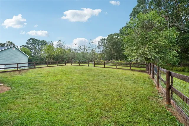 a view of a golf course with a lake