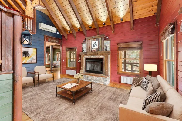 a view of an entryway with a fireplace and a window