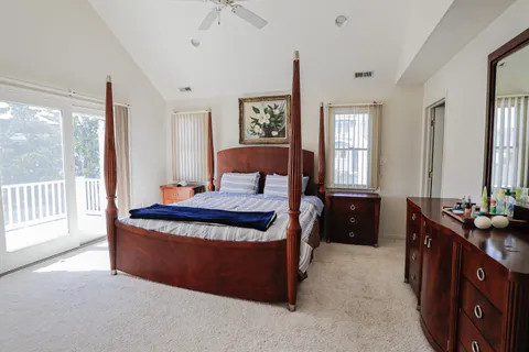 a bed room with a bed and a table