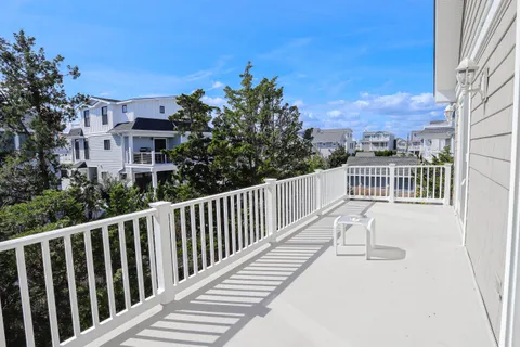 a view of a chair and table in the balcony