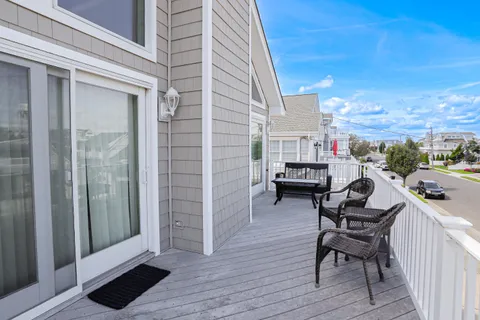 a balcony view with a seating space