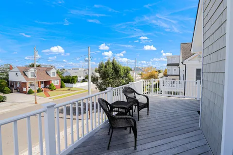 a view of a balcony with furniture