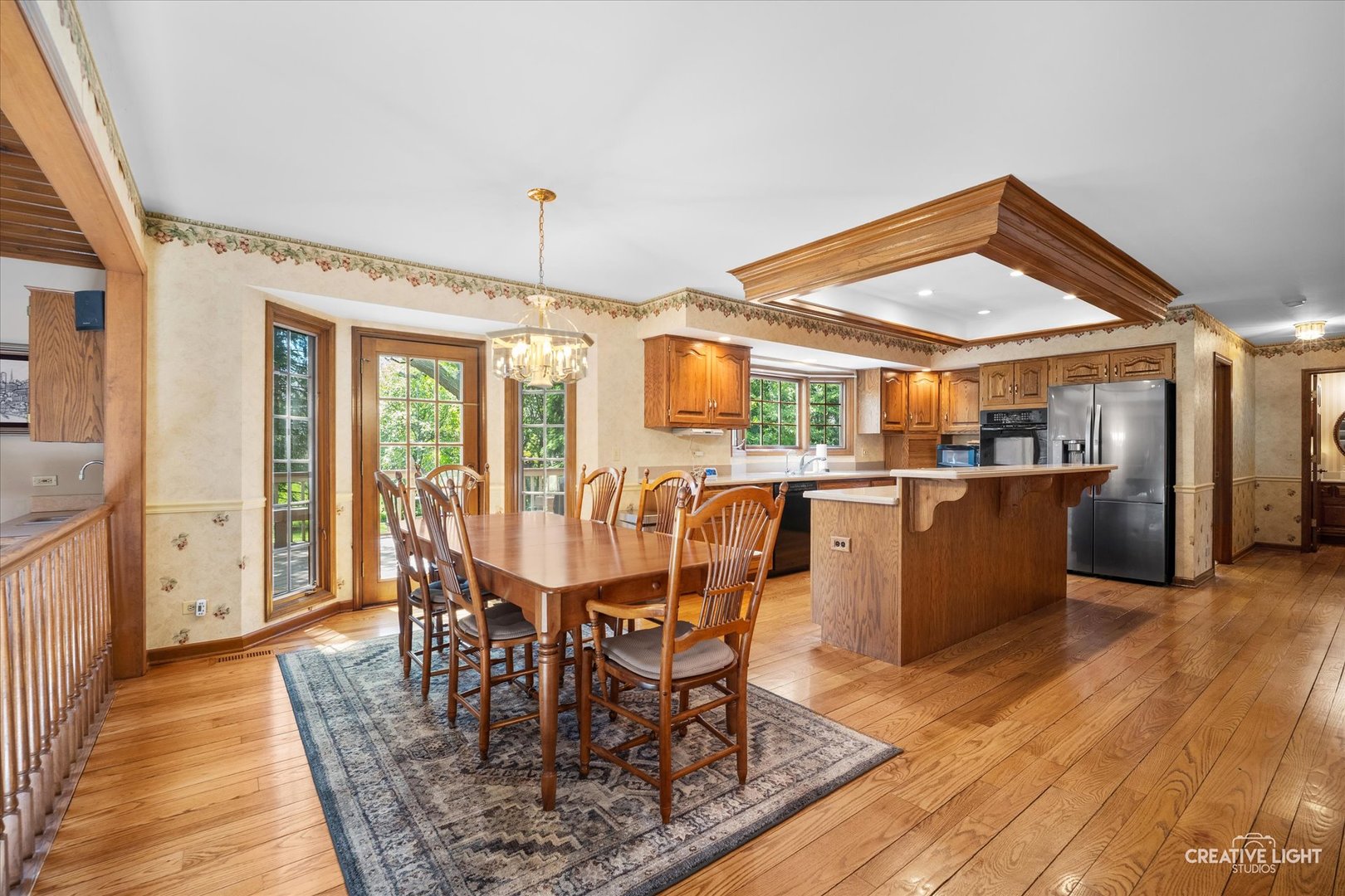 3112 Turnberry Road St. Charles, IL 60174 - Photo 13 of 43 a dining room with furniture a rug and wooden floor