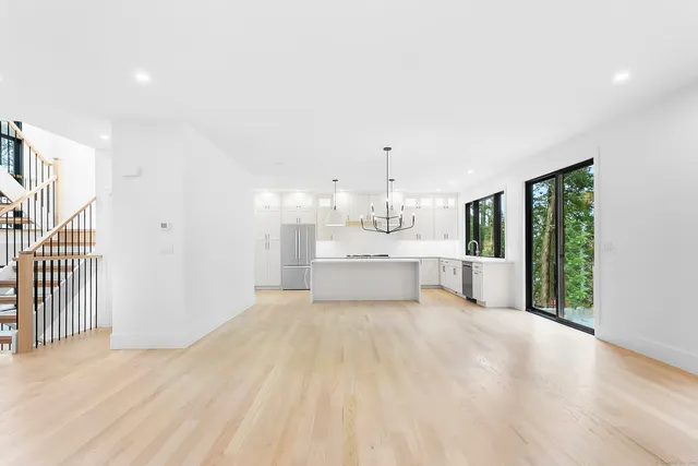 a view of a kitchen with a sink and a window