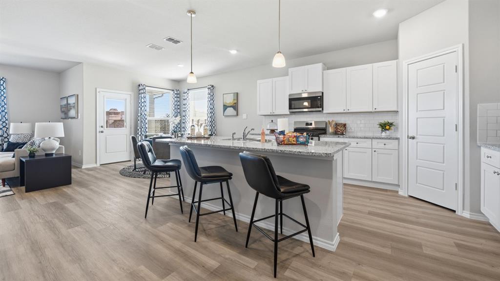 15936 Stableford Road Justin, TX 76247 - Photo 28 of 30 Kitchen-All Home and community information, including pricing, included features, terms, availability and amenities, are subject to change at any time without notice or obligation. All Drawings, pictures, photographs, video, square footages, floor plans, elevations, features, colors and sizes are approximate for illustration purposes only and will vary from the homes as built.