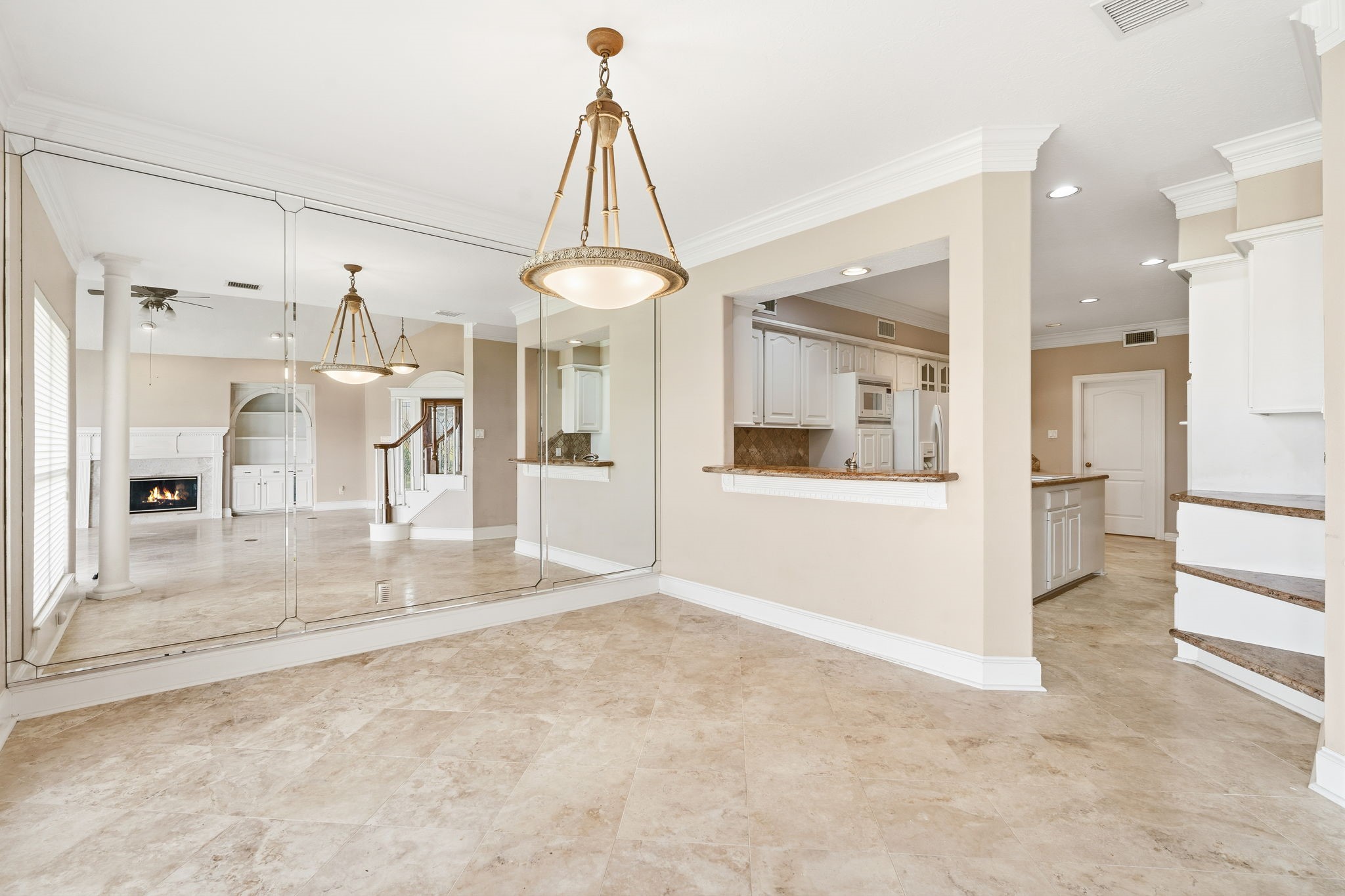 106 Cove Point Montgomery, TX 77356 - Photo 10 of 48 a view of a hallway with a dining table and a refrigerator