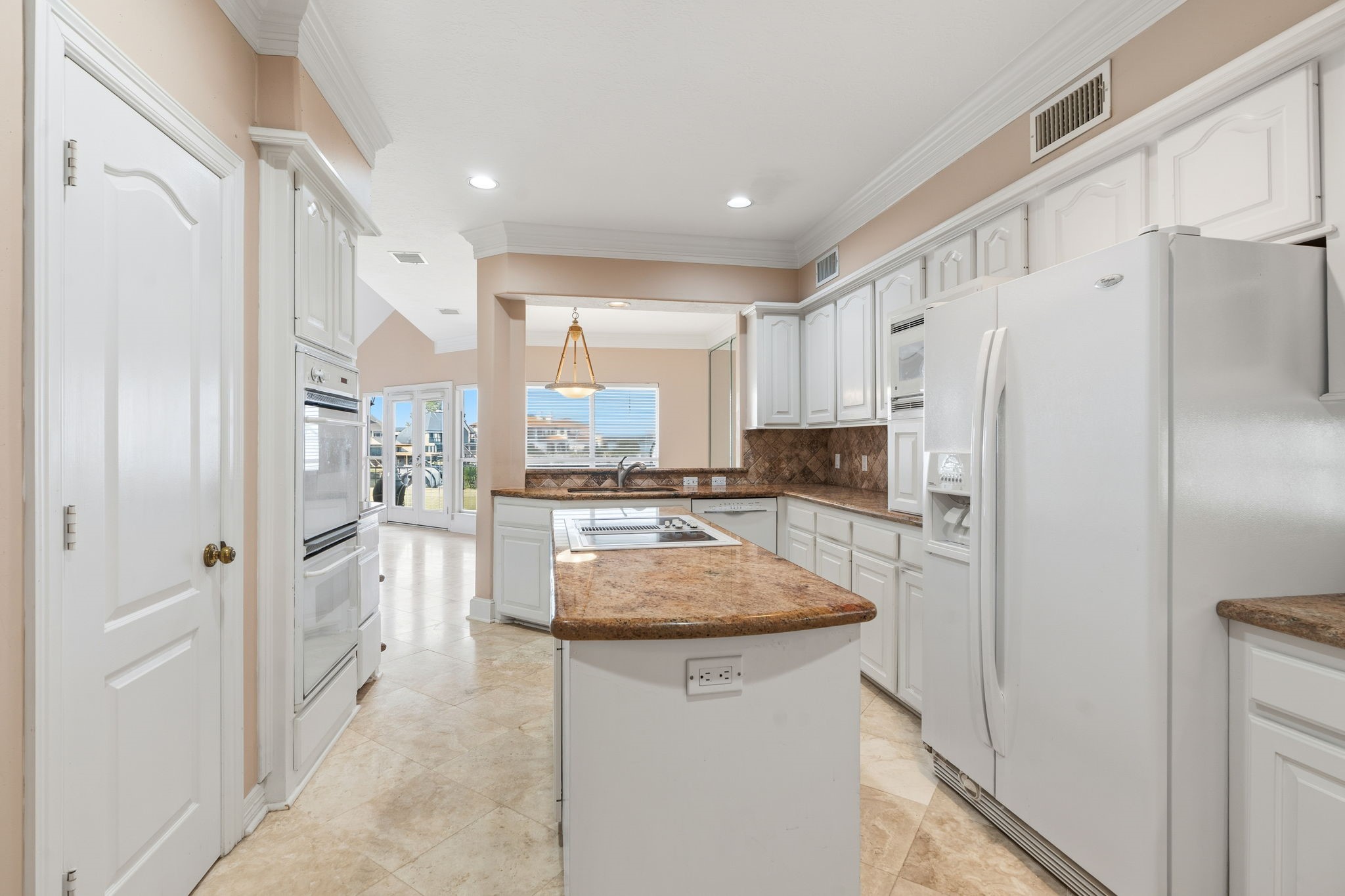 106 Cove Point Montgomery, TX 77356 - Photo 12 of 48 a kitchen with stainless steel appliances a refrigerator sink and cabinets