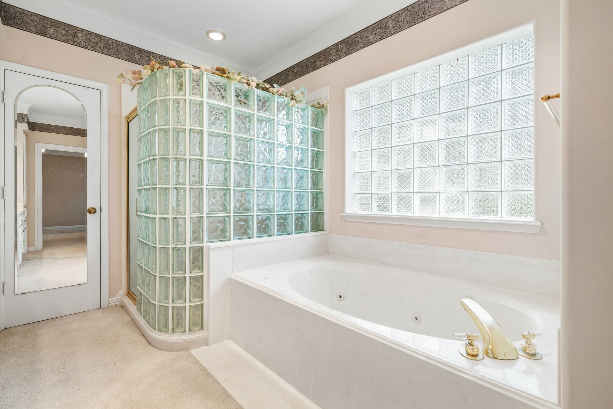 106 Cove Point Montgomery, TX 77356 - Photo 17 of 48 a bathroom with a bathtub and a shower